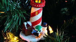 Preview wallpaper christmas tree, garlands, house, lighthouse, penguin, snowman, figurines, holiday