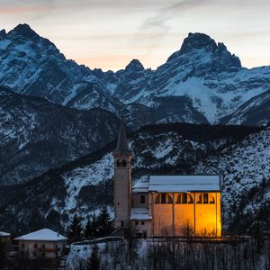 Preview wallpaper church, building, mountains, snow, sunset