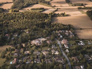 Preview wallpaper city, aerial view, buildings, fields, trees