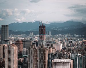 Preview wallpaper city, aerial view, buildings, mountains, architecture