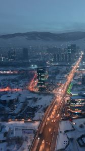 Preview wallpaper city, aerial view, buildings, road, mountain, snow