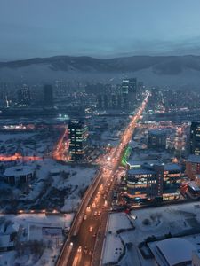 Preview wallpaper city, aerial view, buildings, road, mountain, snow