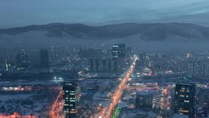 Preview wallpaper city, aerial view, buildings, road, mountain, snow