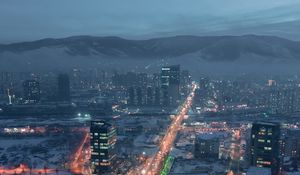 Preview wallpaper city, aerial view, buildings, road, mountain, snow