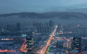 Preview wallpaper city, aerial view, buildings, road, mountain, snow