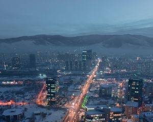 Preview wallpaper city, aerial view, buildings, road, mountain, snow