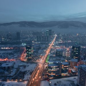 Preview wallpaper city, aerial view, buildings, road, mountain, snow