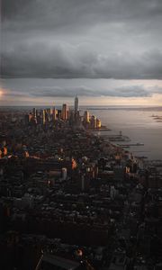 Preview wallpaper city, aerial view, buildings, coast, sunset, dusk
