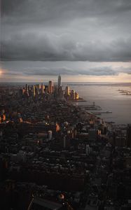 Preview wallpaper city, aerial view, buildings, coast, sunset, dusk