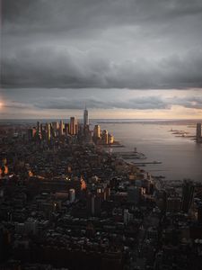 Preview wallpaper city, aerial view, buildings, coast, sunset, dusk