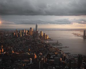 Preview wallpaper city, aerial view, buildings, coast, sunset, dusk