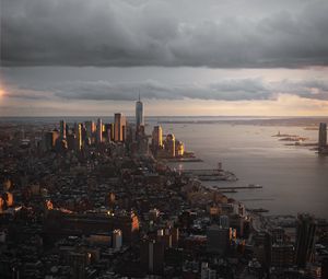 Preview wallpaper city, aerial view, buildings, coast, sunset, dusk