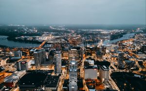 Preview wallpaper city, aerial view, buildings, lights, river, horizon