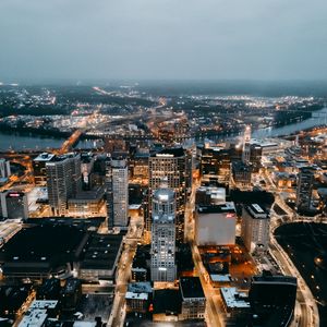 Preview wallpaper city, aerial view, buildings, lights, river, horizon