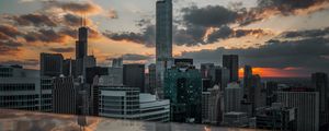 Preview wallpaper city, aerial view, buildings, sunset, reflection