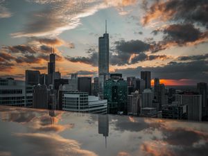 Preview wallpaper city, aerial view, buildings, sunset, reflection
