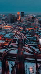 Preview wallpaper city, aerial view, buildings, roads, snow, dusk