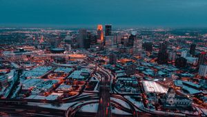 Preview wallpaper city, aerial view, buildings, roads, snow, dusk