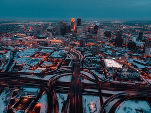 Preview wallpaper city, aerial view, buildings, roads, snow, dusk