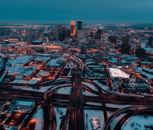 Preview wallpaper city, aerial view, buildings, roads, snow, dusk