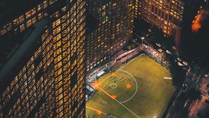 Preview wallpaper city, aerial view, buildings, football ground, night, lights