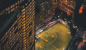 Preview wallpaper city, aerial view, buildings, football ground, night, lights