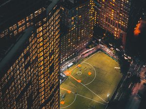 Preview wallpaper city, aerial view, buildings, football ground, night, lights