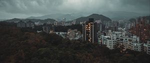 Preview wallpaper city, aerial view, buildings, trees, clouds