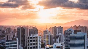 Preview wallpaper city, aerial view, buildings, sunset