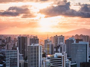 Preview wallpaper city, aerial view, buildings, sunset