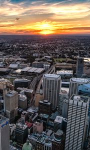Preview wallpaper city, aerial view, buildings, cityscape, sunset