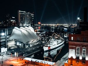 Preview wallpaper city, aerial view, buildings, ship, pier, night, lights