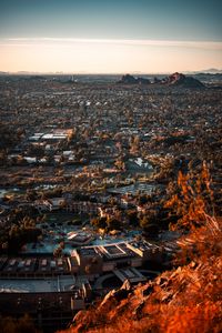 Preview wallpaper city, aerial view, buildings, trees, mountains, cityscape