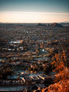 Preview wallpaper city, aerial view, buildings, trees, mountains, cityscape