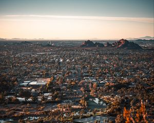 Preview wallpaper city, aerial view, buildings, trees, mountains, cityscape