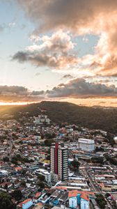 Preview wallpaper city, aerial view, buildings, mountains, sunset