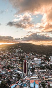 Preview wallpaper city, aerial view, buildings, mountains, sunset