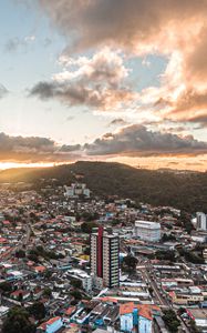 Preview wallpaper city, aerial view, buildings, mountains, sunset