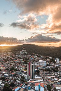 Preview wallpaper city, aerial view, buildings, mountains, sunset