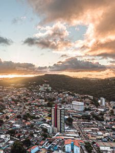 Preview wallpaper city, aerial view, buildings, mountains, sunset
