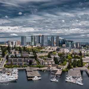 Preview wallpaper city, aerial view, buildings, coast, boats
