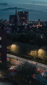 Preview wallpaper city, aerial view, buildings, road, trees, twilight