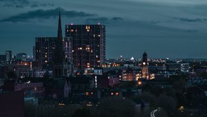 Preview wallpaper city, aerial view, buildings, road, trees, twilight