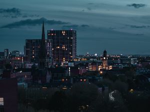 Preview wallpaper city, aerial view, buildings, road, trees, twilight