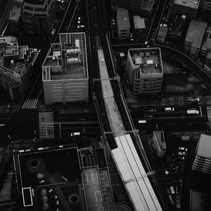 Preview wallpaper city, aerial view, buildings, road, black and white