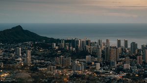 Preview wallpaper city, aerial view, cityscape, water, mountain, grass