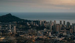 Preview wallpaper city, aerial view, cityscape, water, mountain, grass