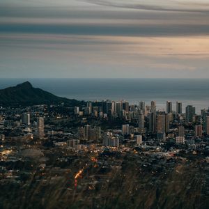 Preview wallpaper city, aerial view, cityscape, water, mountain, grass