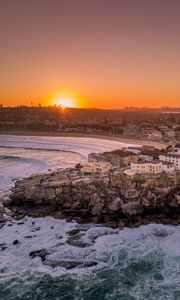 Preview wallpaper city, aerial view, coast, sunset, sea, beach, buildings