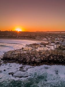 Preview wallpaper city, aerial view, coast, sunset, sea, beach, buildings